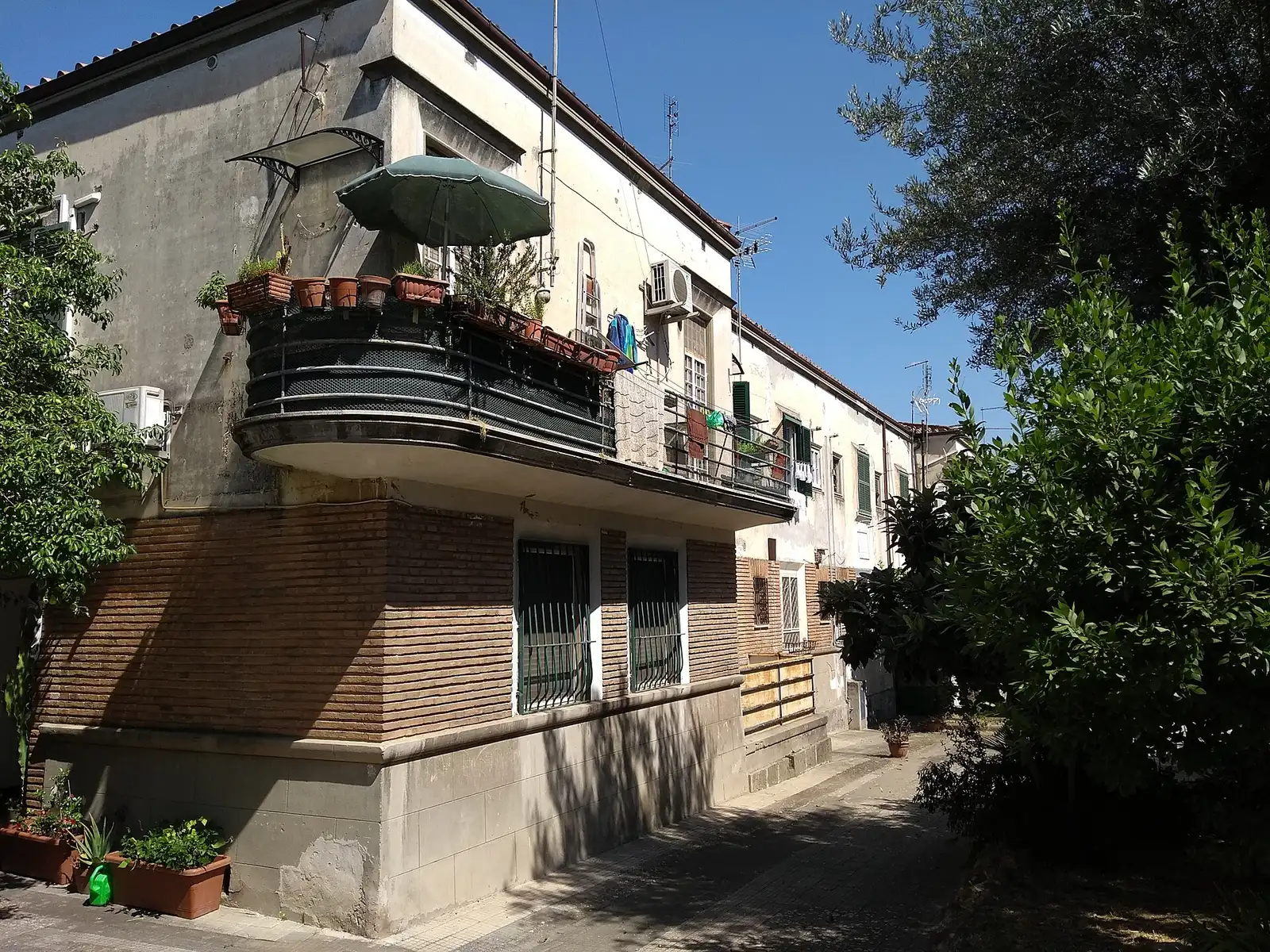 Residential buildings with balconies and plants in the Garbatella district of Rome