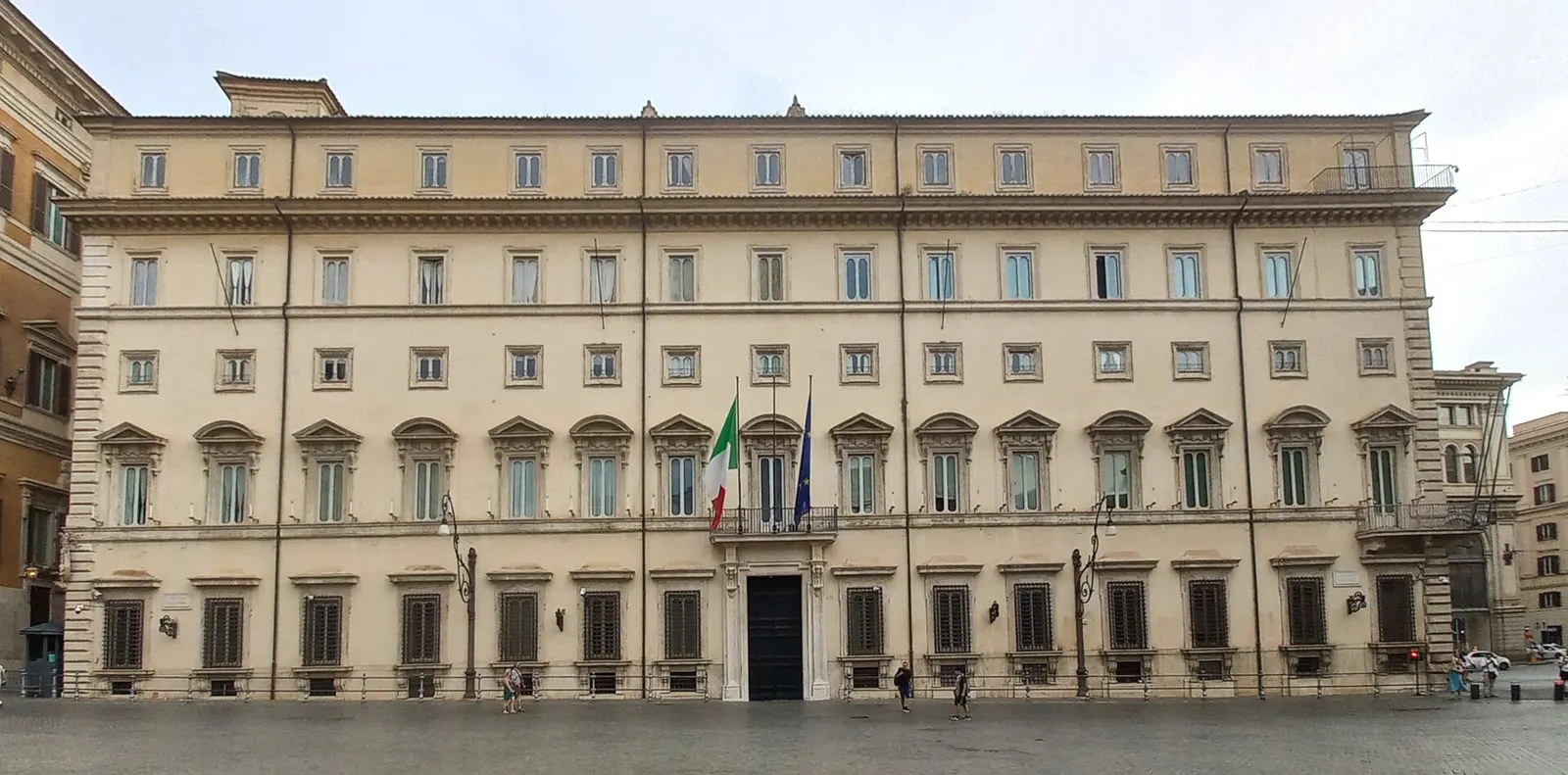 Façade of Palazzo Chigi in Rome, with the Italian and European Union flags above the entrance