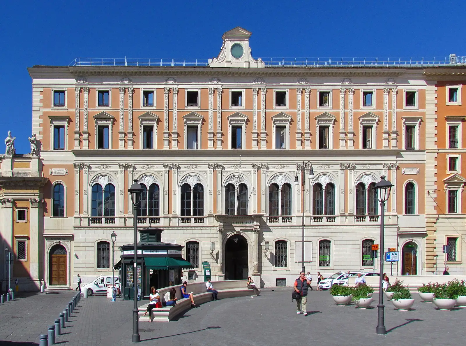 The central post office on Piazza di San Silvestro in Rome under a blue sky